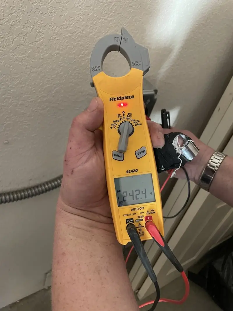 Voltage testing with clamp meter during Electrical Installation Services in Sykesville